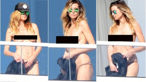 Heidi Klum se asolea en "topless"